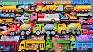 kids toys expands his collection of small cars, truck, jcb, bus, school bus,