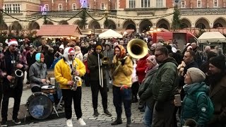 Street Music in Poland. Amazing Band Plays in the Main Square of the Old Town of Kraków