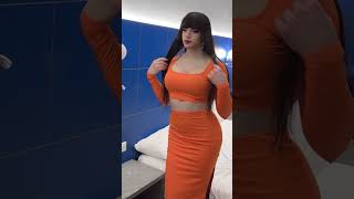 crossdresser in orange dress