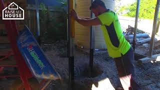 Pouring Concrete In Holes - House Raising Process