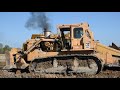 Cat D9H pushing 631E