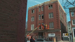 Baltimore officials survey work of city-owned historic building