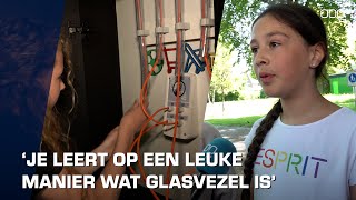 Kinderen leren over glasvezel in KPN-escapebussen