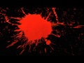 Slow Motion Paint Splatter with Red Paint Splattering a Black Background in HD Slow Mo Video View