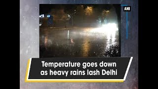 Temperature goes down as heavy rains lash Delhi - Delhi News