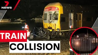 The moment train collides with car caught on camera | 7 News Australia
