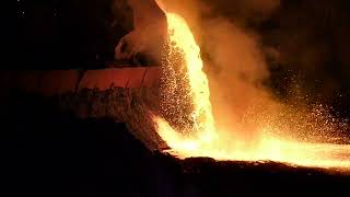 Unloading slag in a steel foundry at night