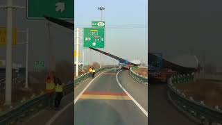 Two Workers Hilariously Dangle From Giant Windmill Wing To Get It Under Road Sign! #comedy #tech