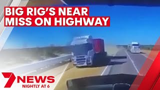 Truck driver's close call with another big rig caught on dashcam | 7NEWS