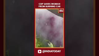 Watch Dramatic Footage: U.S Police Officer Smashes Car Window And Pulls Out A Woman From Burning Car