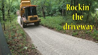 Spreading Rock On The Driveway And Cleaning Up The Site