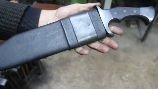 Making a scabbard for a large bowie knife.