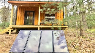 Off grid tiny cabin gets  harbor freight solar panel kit installation and I wire 12 /110 volt system