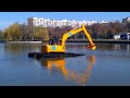 excavator amfibiu plutitor romwaclean