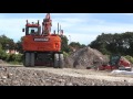 doosan dx140w it4 wheeled excavator at work