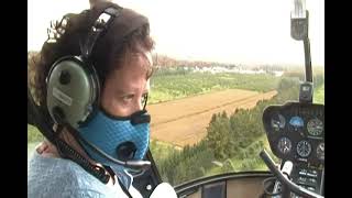 Flying Robinson R44 helicopter in heavy turbulence over Rougemont, Quebec. October 2020.