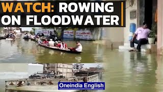 Bihar: People use boats to commute in flooded roads of Muzaffarpur | Watch | Oneindia News