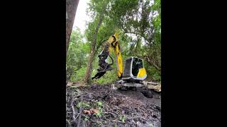 Spider excavator in muddy ditch