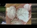 homeowners clean up after severe hailstorm