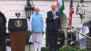 Biden oddly puts hand on heart for India anthem at Narendra Modi welcome