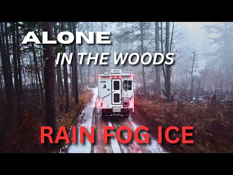 Winter Camping Alone in the Rain with the Shelter of a Warm Truck Camper.