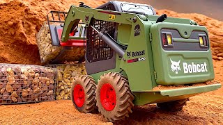 AWESOME RC SKID STEER Bobcat building a stonewall - by Constructionzone-RC in Germany