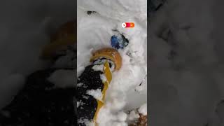 Skier digs out snowboarder buried under snow