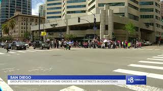 San Diego groups are protesting the government's stay-at-home orders with a walk in downtown