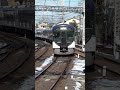 a japanese express train passes through a station on a snowy day. january 31 2023. shorts