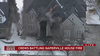 Crews battling house fire in Naperville