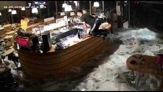 Security Footage Shows Wave Crashing Through Windows of Italian Restaurant