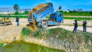 Amazingly Machine Bulldozer MITSUBISHI BD2F,Unloading pushing stone into flooded using Truck 5Ton