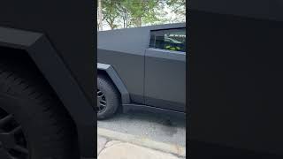 Tesla Cybertruck matte black EV electric pickup truck in the wild 2024