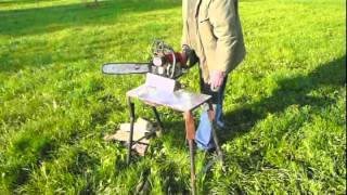 Cutting wood with a chainsaw : an ingenious sawhorse