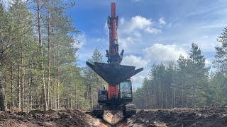 Maaparandustööd kännujuurija ja profiilkopaga / earthworks with a stump ripper and a ditch bucket