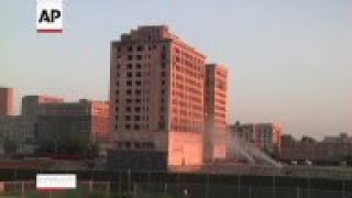 Crews imploded a 13-story historic former hotel in Detroit as part of a construction project for a n