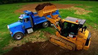 Cat® D-Series Track Type Loaders in Action | 953D - 963D - 973D