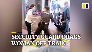 Security guard drags woman off train, sparking outrage in China