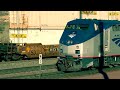 bnsf eb intermodal with 2 warbonnets meets a late running southwest chief at old cajon station