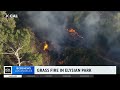 firefighters quickly contain fire burning in grass in elysian park