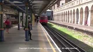 London Underground trains at South Kensington station, Circle and District