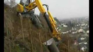 Menzi Muck A91 sideways on a hillside working in a vineyard