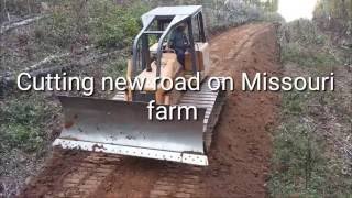 Cutting new road with Bulldozer on Missouri farm