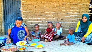 African Village Life Of Our Organic Mom Cooks Village Food Tumeric Rice, Potato Curry With Beans.