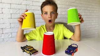 Mark finds cars under multi-colored cups