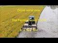 Thai farmers using tractor in a rice field in Thailand.