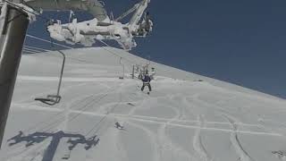 Niseko Wonderland Chair lift under blue sky