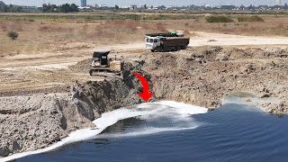 Great skill!! bulldozer Komatsu Driver Pushing Soil Into Water With Dump Truck 22 Ton.