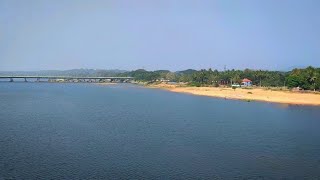 Train passing slowly through the beautiful Bharathapuzha Railway Bridge