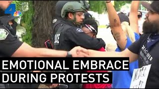 Protester Hugs Officers as They Stand Watch Over Upland Demonstration | NBCLA